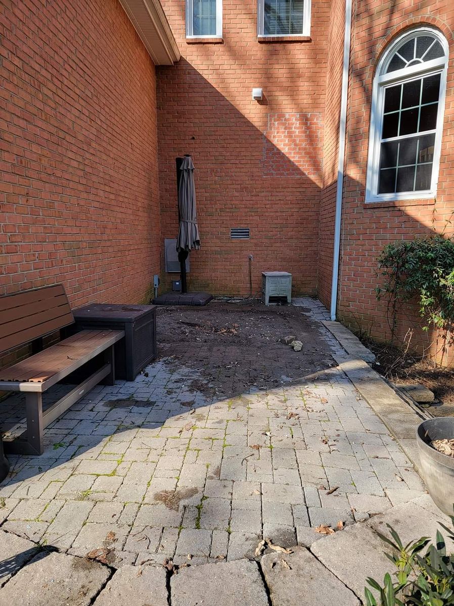 Empty paver patio after the hot tub was removed