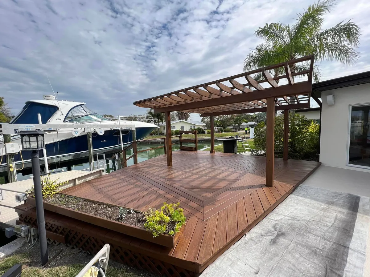 Waterfront pool deck and pergola refinished by Garrity Painting in Pinellas County, Florida