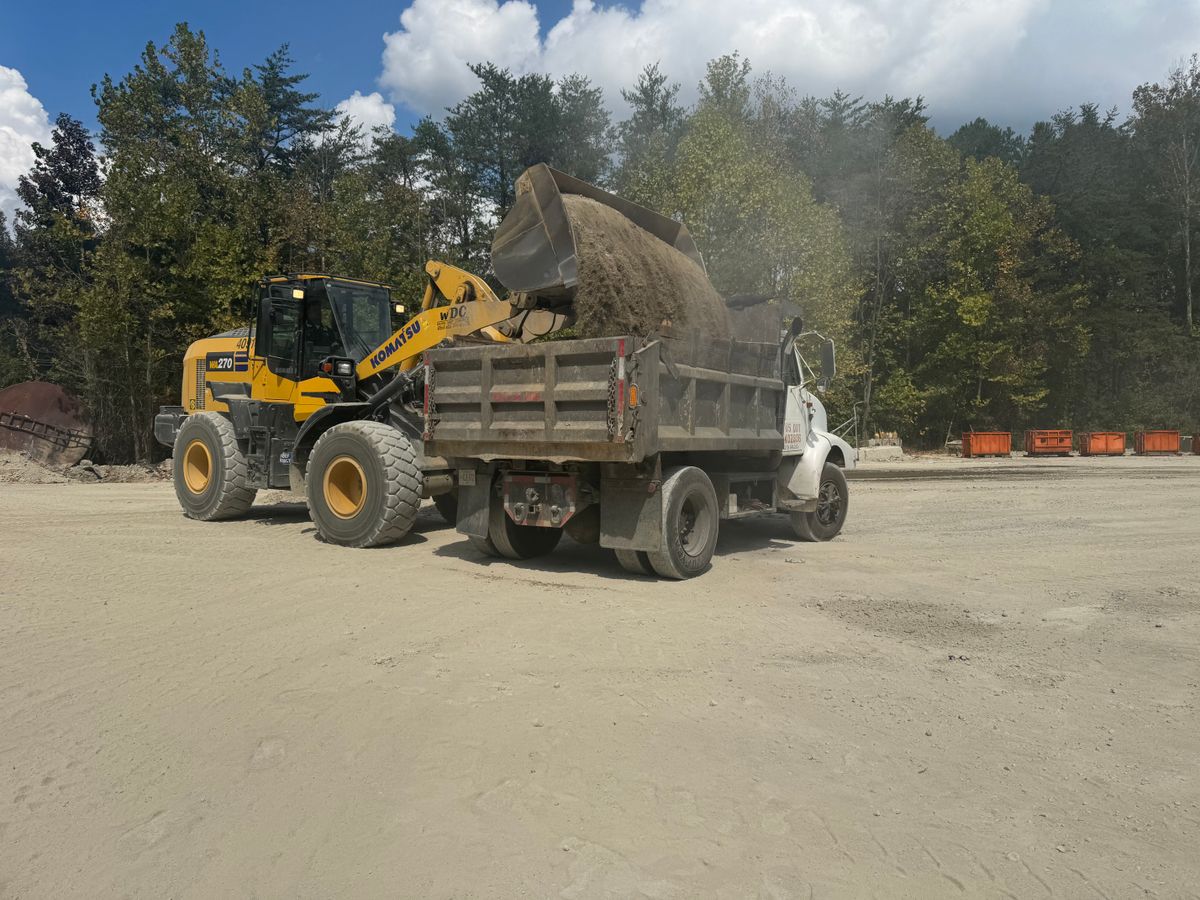 Gravel hauling and spreading for Under Grace Transport and Grading in Marble Hill, GA