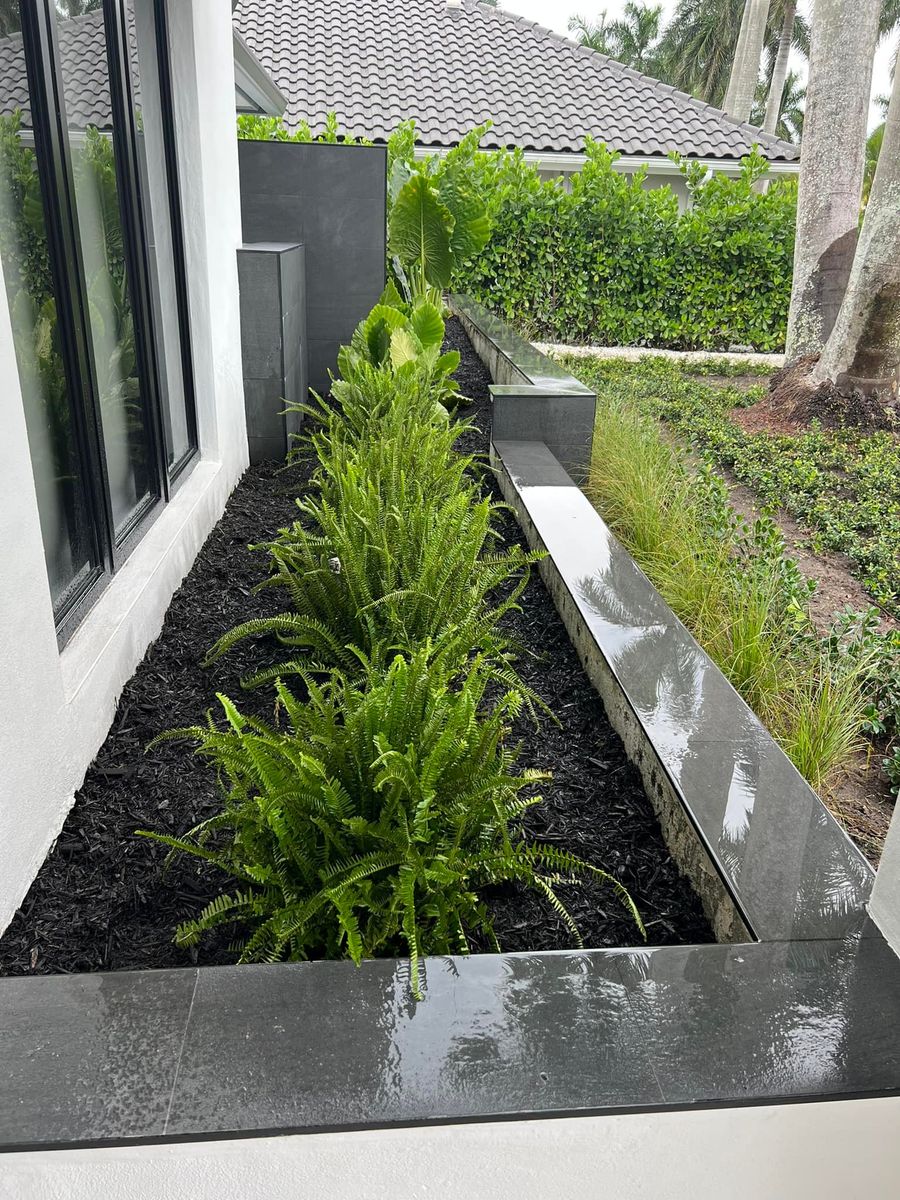 Mulch Installation for An Extravagant Landscape & Lawn Service in Delray, FL