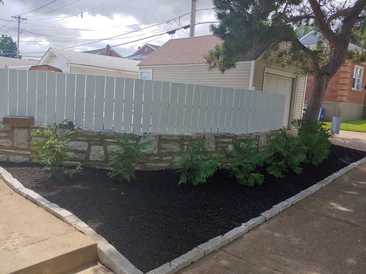 Mulch Installation for VQ Land & Stone in St. Louis, MO