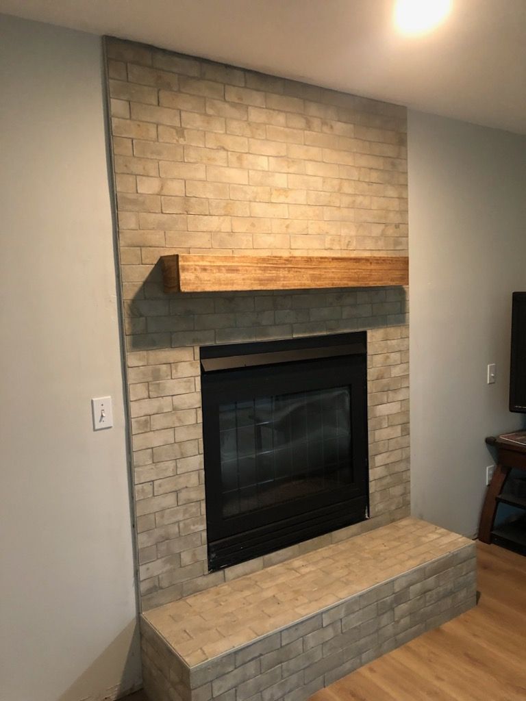 Fireplace and Stone on Chimney for CSR Tile Construction in Fridley, MN