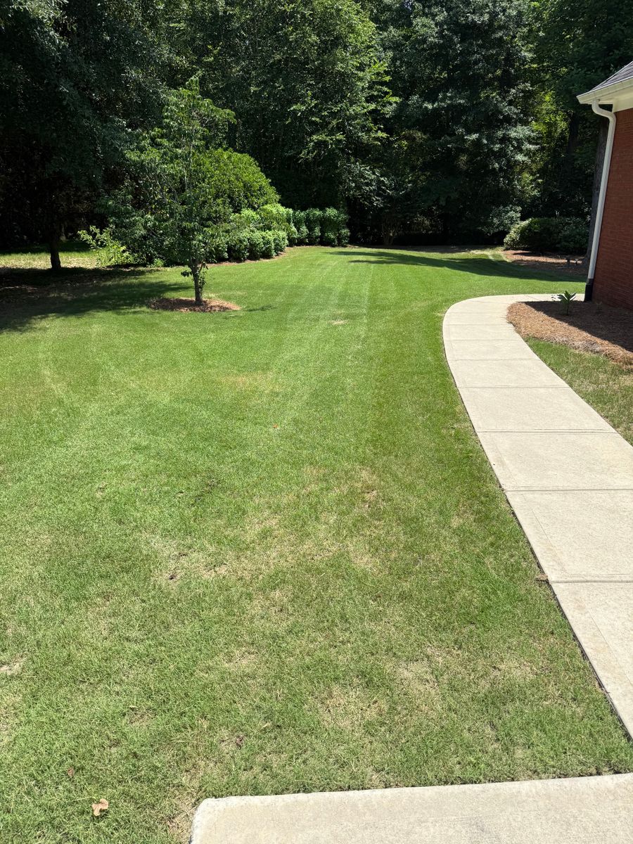 Mowing for Clark's Cuts Lawn Care in Lilburn, GA