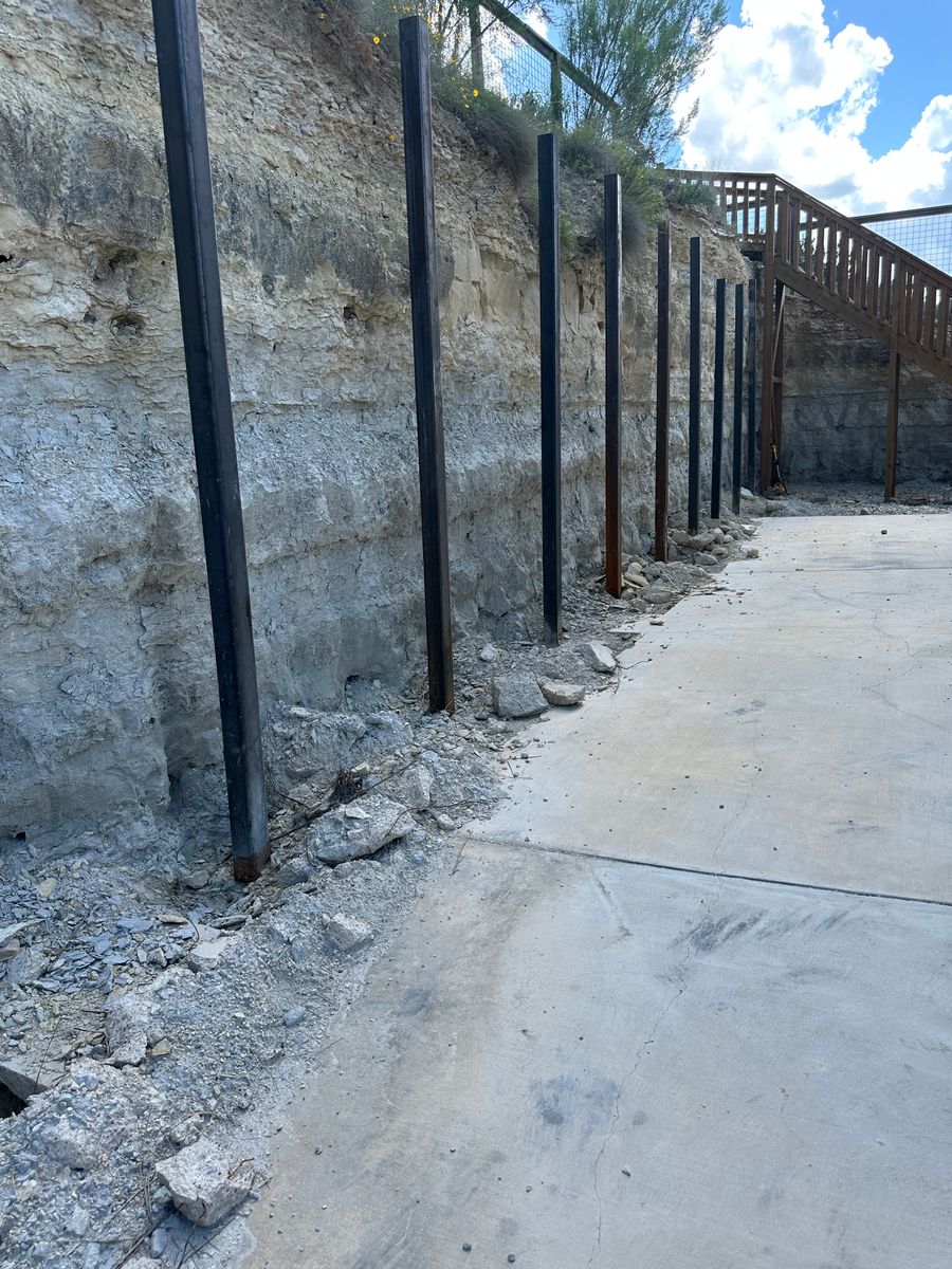 Retaining Wall Construction for Clean Green Landscape Design in Dripping Springs, TX