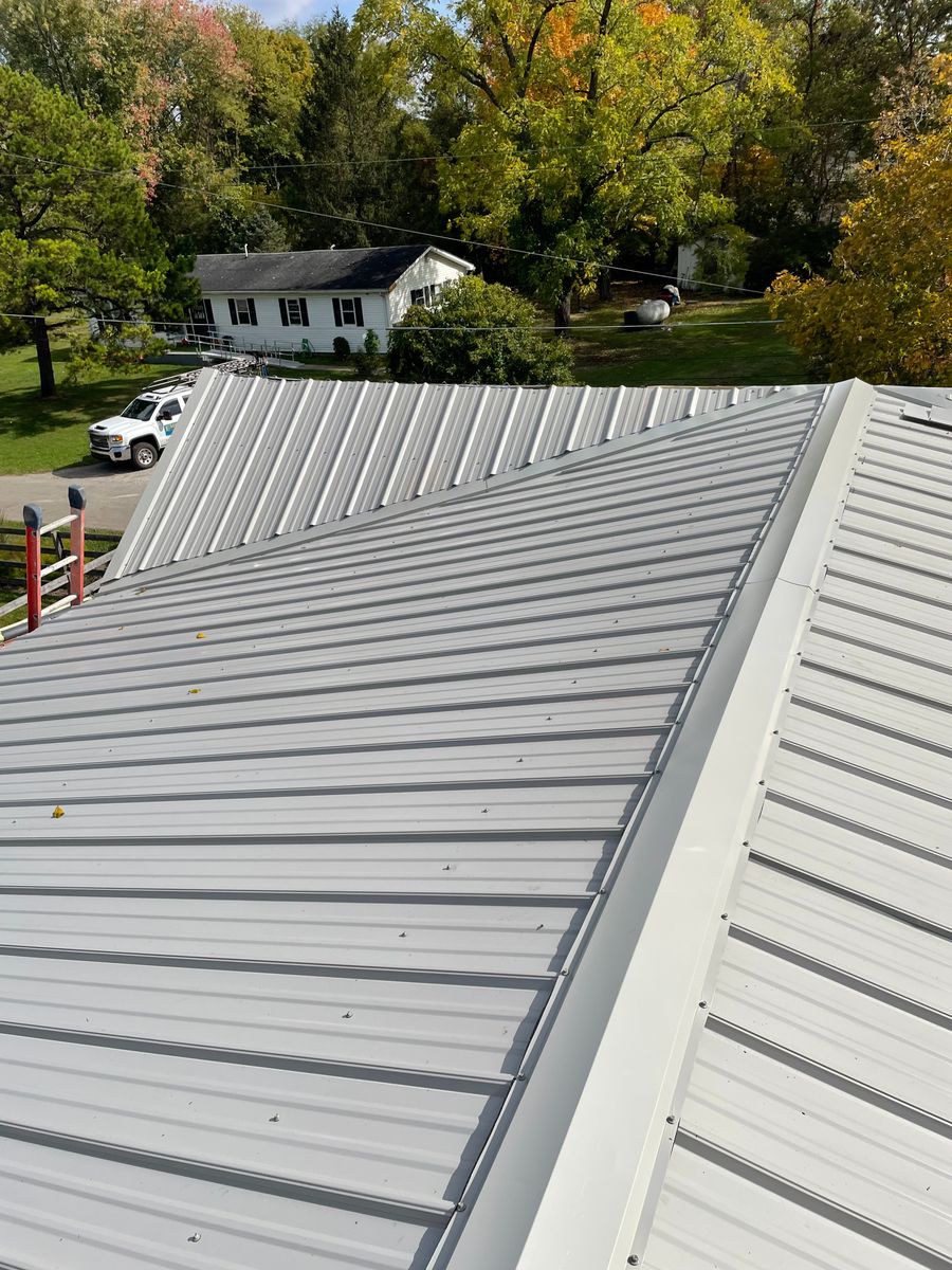 Metal roof installation for Precious Roofing in Madeira, OH