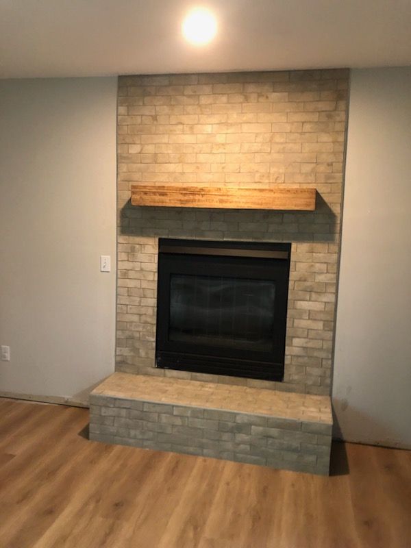 Fireplace and Stone on Chimney for CSR Tile Construction in Fridley, MN