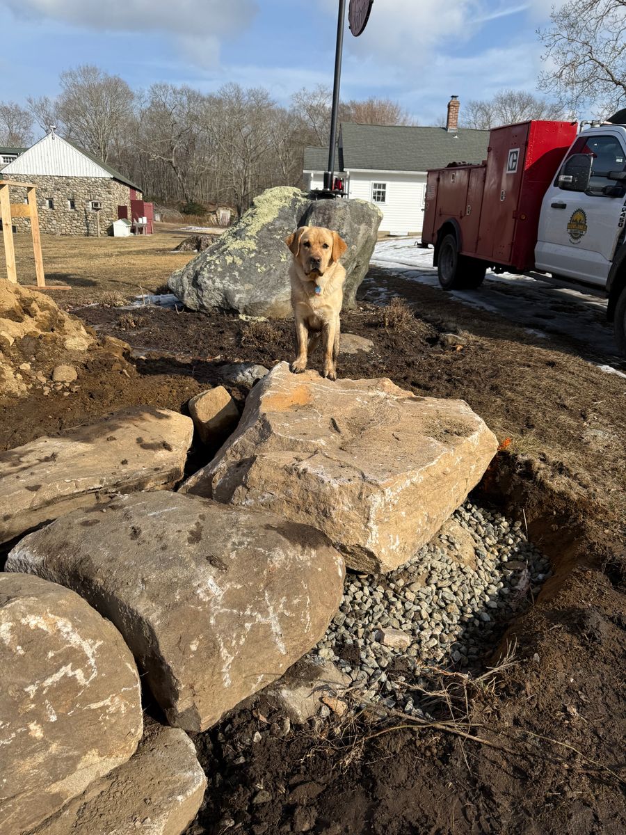 Machine set stone retaining walls for DArcy  Cleveland & Sons Excavation LLC in Pawcatuck, CT