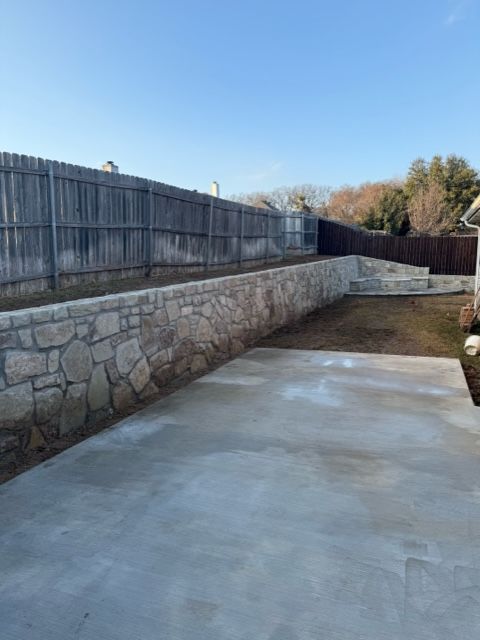 Remove old railroad ties replace with new sandstone for Rojas Contractors in Fort Worth, TX