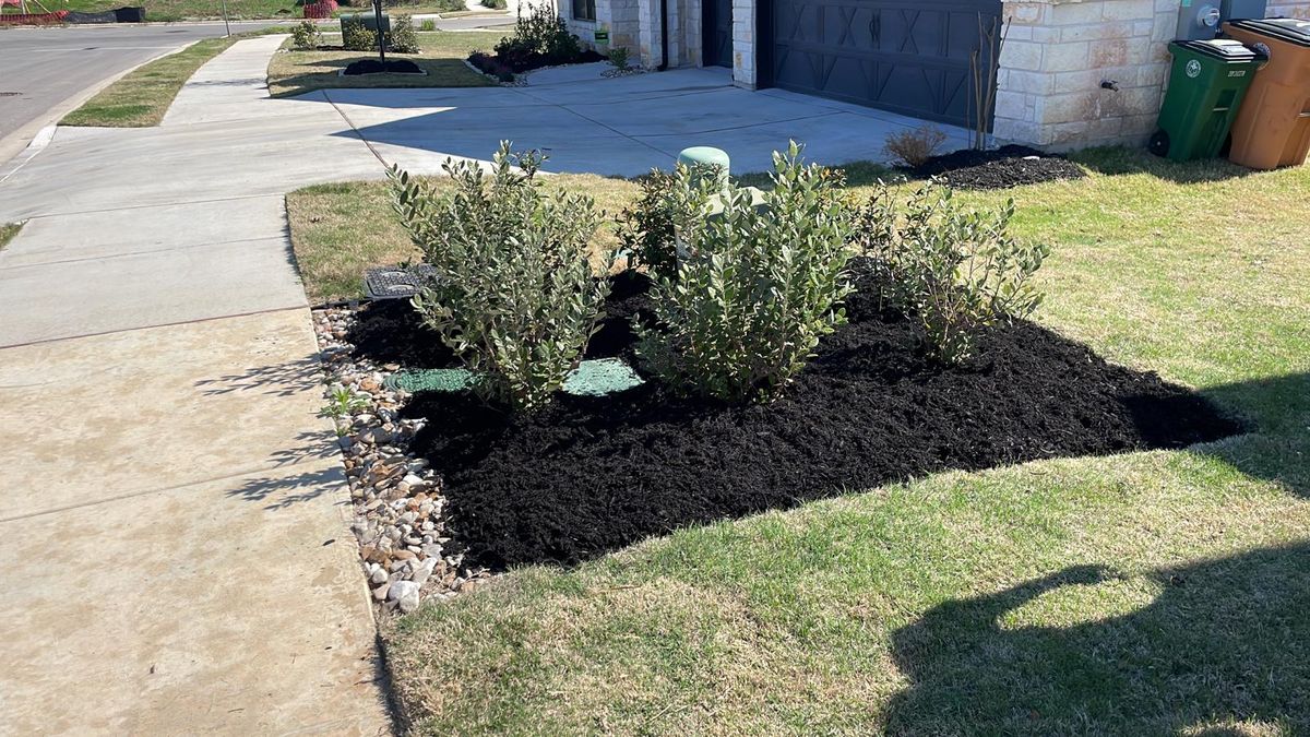 Mulching for Green Pastures Lawn Care in Bastrop, TX