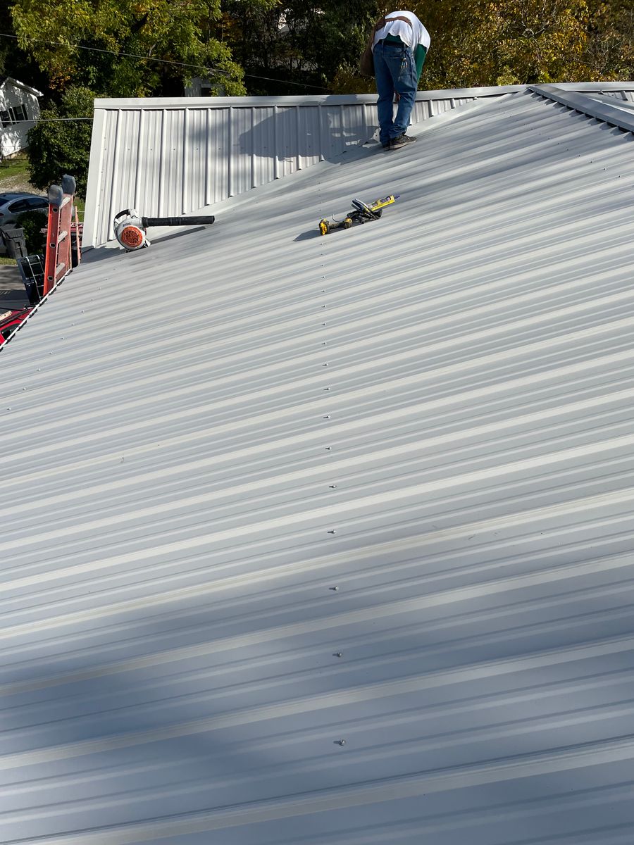 Metal roof installation for Precious Roofing in Madeira, OH