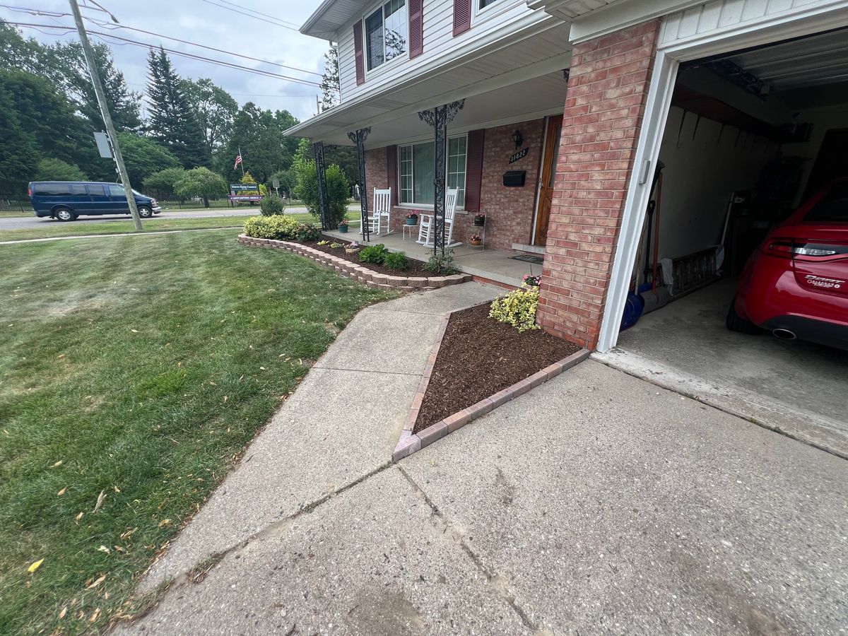 Decorative stone/Mulch Installation for Alltimate Outdoor Services in Warren, MI