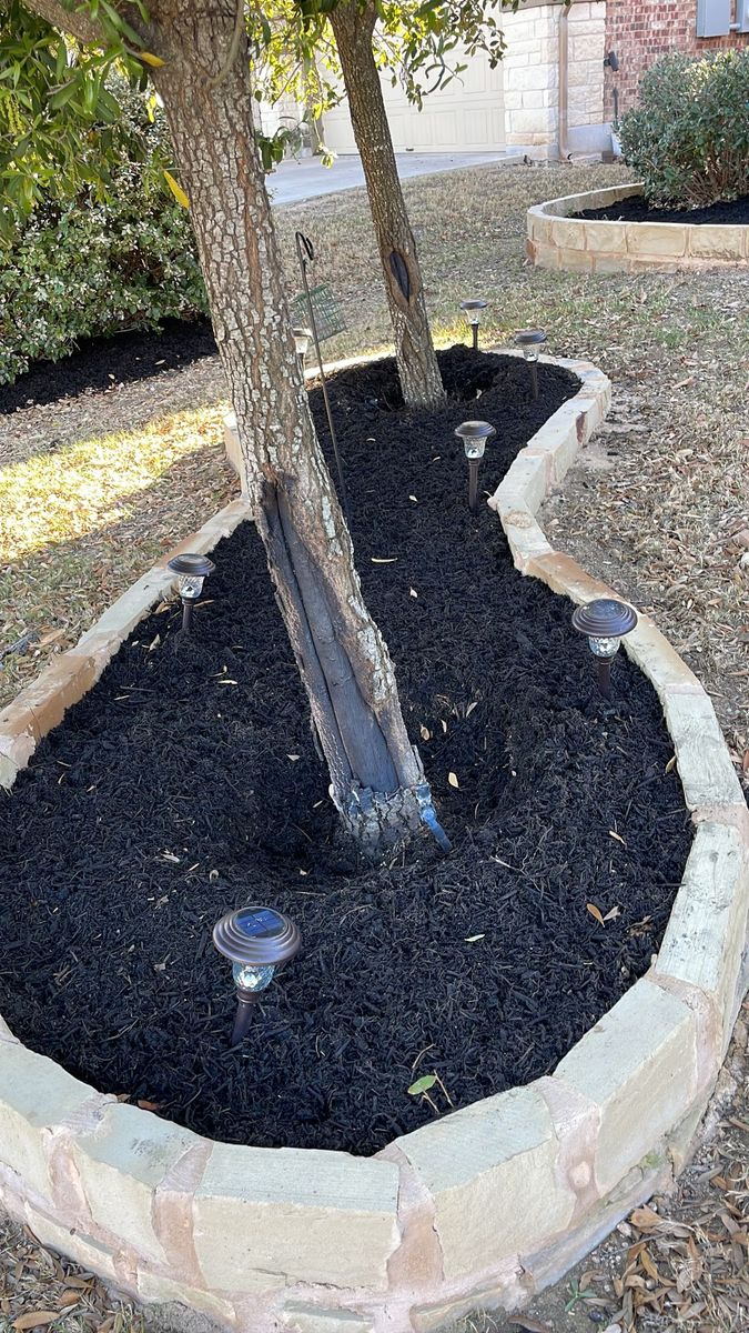 Mulching for Green Pastures Lawn Care in Bastrop, TX