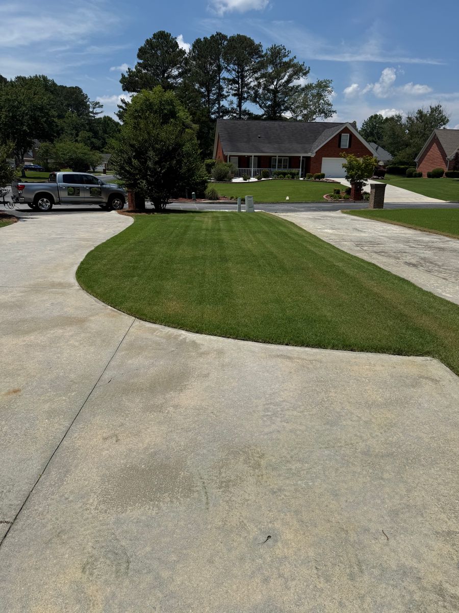 Mowing for Clark's Cuts Lawn Care in Lilburn, GA