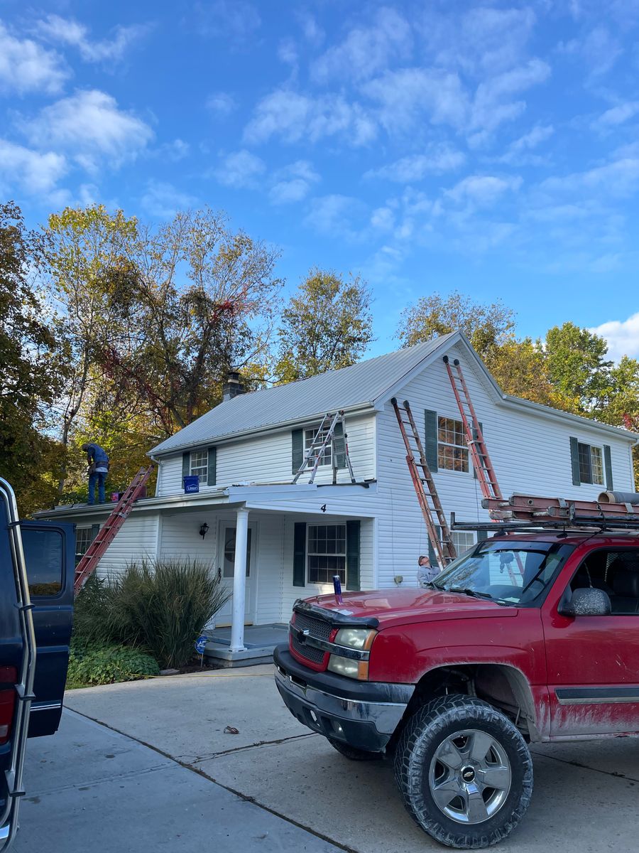 Metal roof installation for Precious Roofing in Madeira, OH