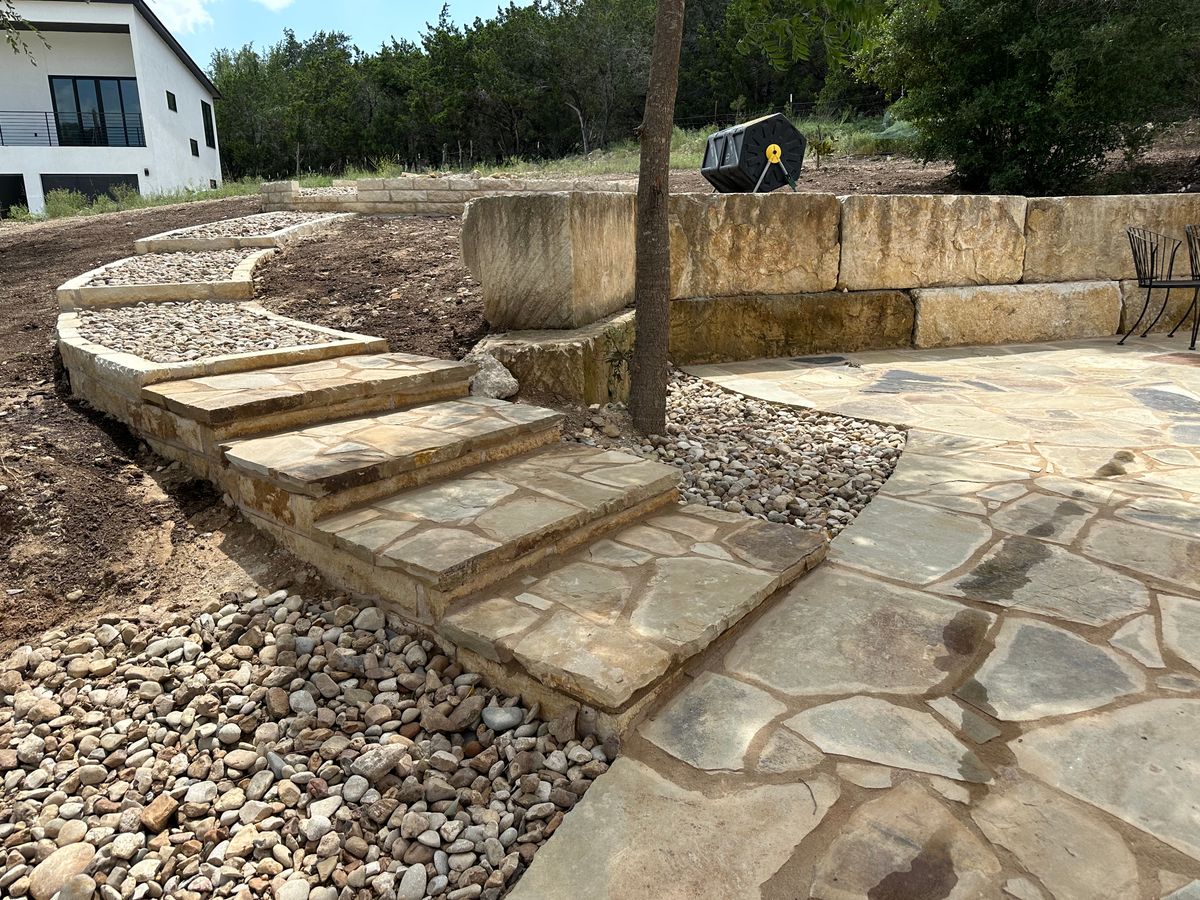 Stone Walkways and Planters for Clean Green Landscape Design in Dripping Springs, TX