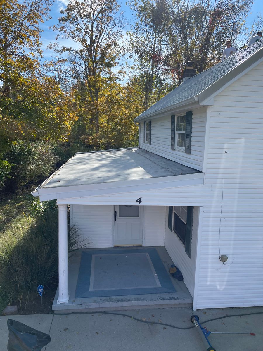 Metal roof installation for Precious Roofing in Madeira, OH