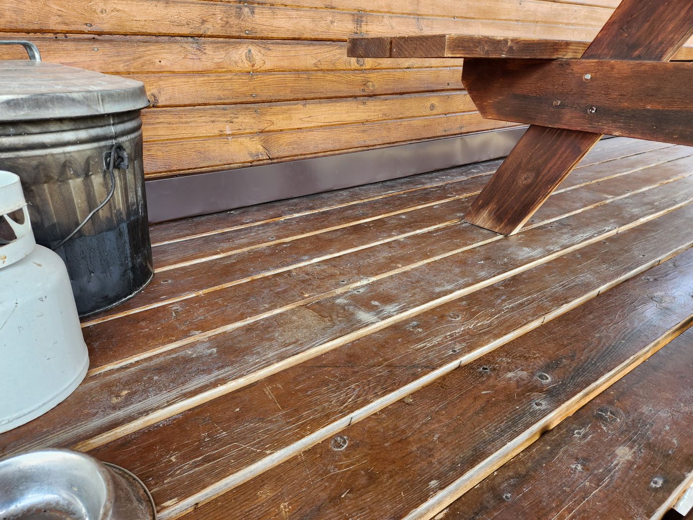 Line hide channel run along a deck on a log home