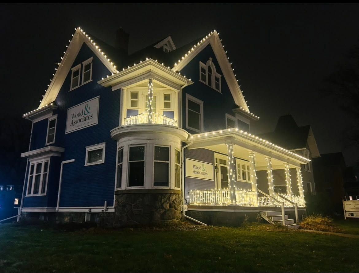 Warm white Christmas lights on a Victorian home in Greater Lansing