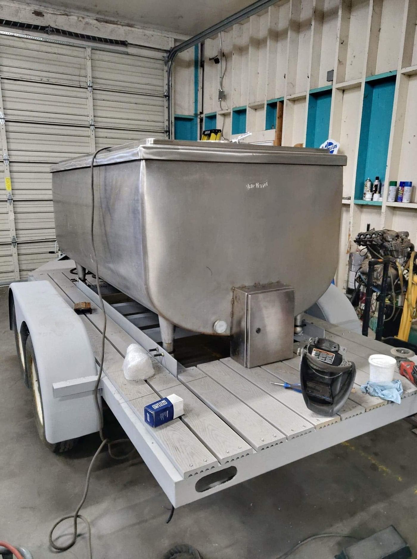Bulk milk tank mounted on a trailer for transport
