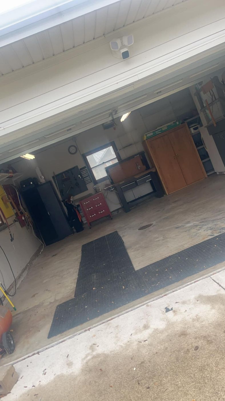 A cleared two-car garage after a cleanout