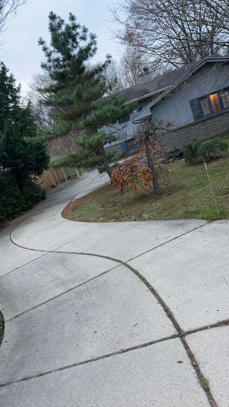 Clean concrete driveway and yard after removal