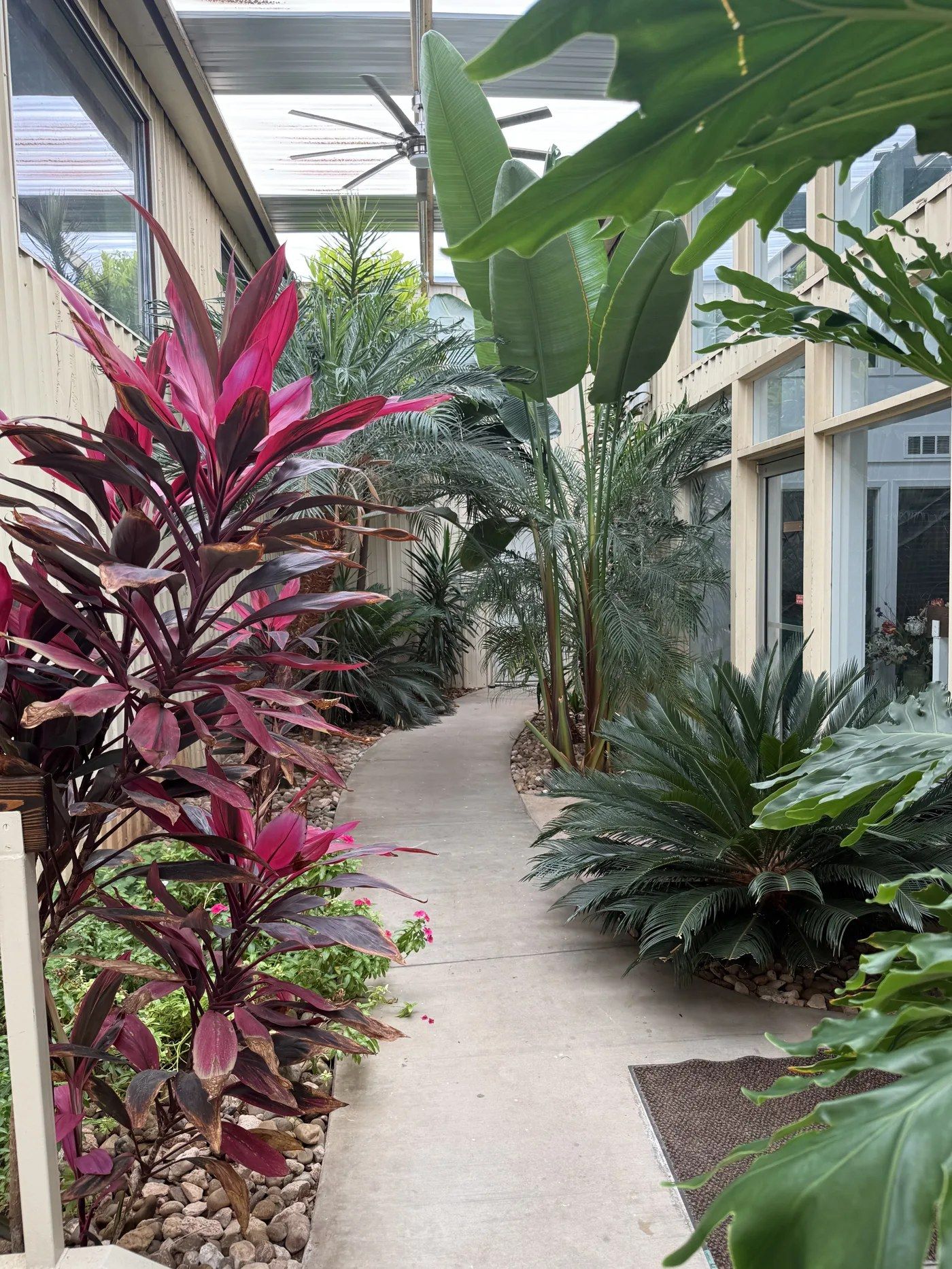 Covered garden walkway leading to the Visten Construction Group office entrance
