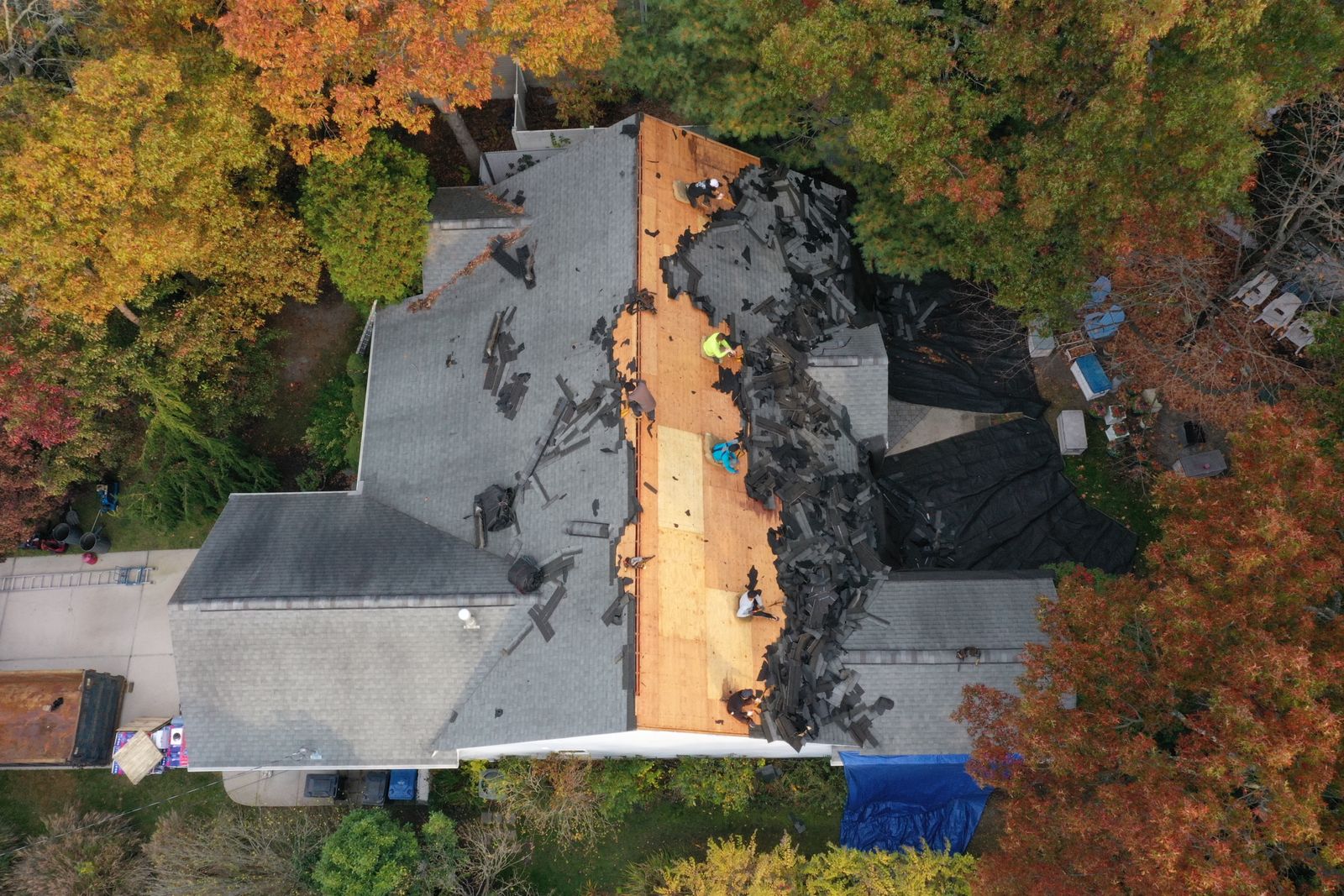 AJ Roof Repair & Replacement crew tearing off and replacing a roof in North Jersey