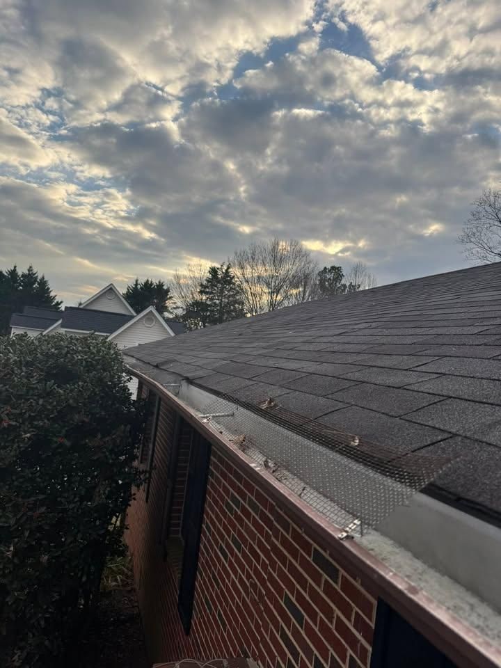 Shingle roof edge and gutter on a brick home