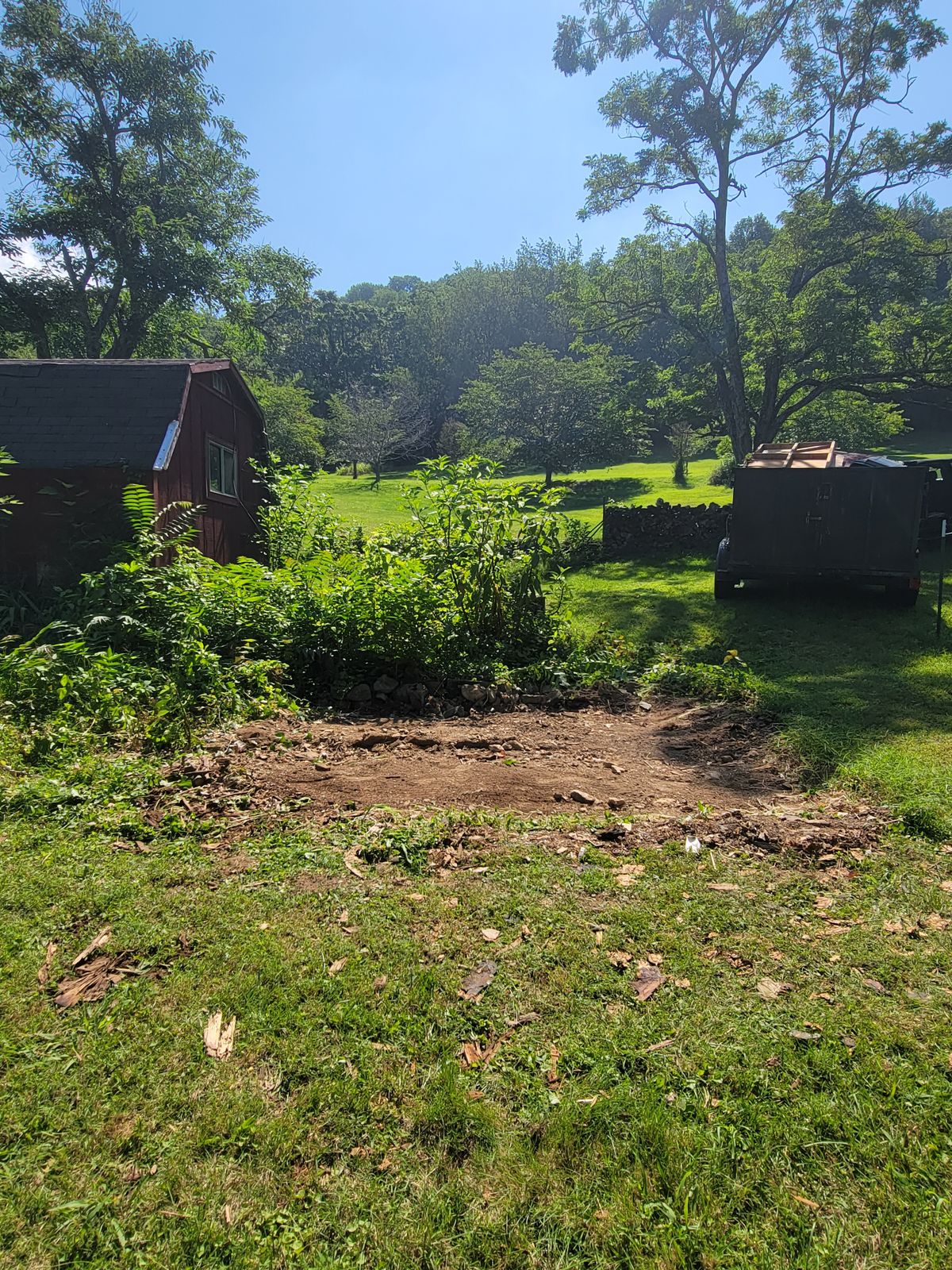 Cleared lot after an old shed was torn down and hauled away