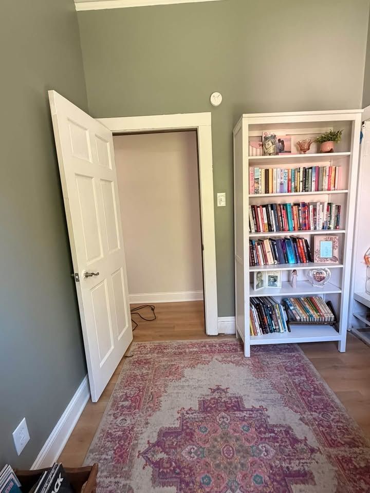 Refinished door and painted casing in a sage green room in La Porte County, Indiana