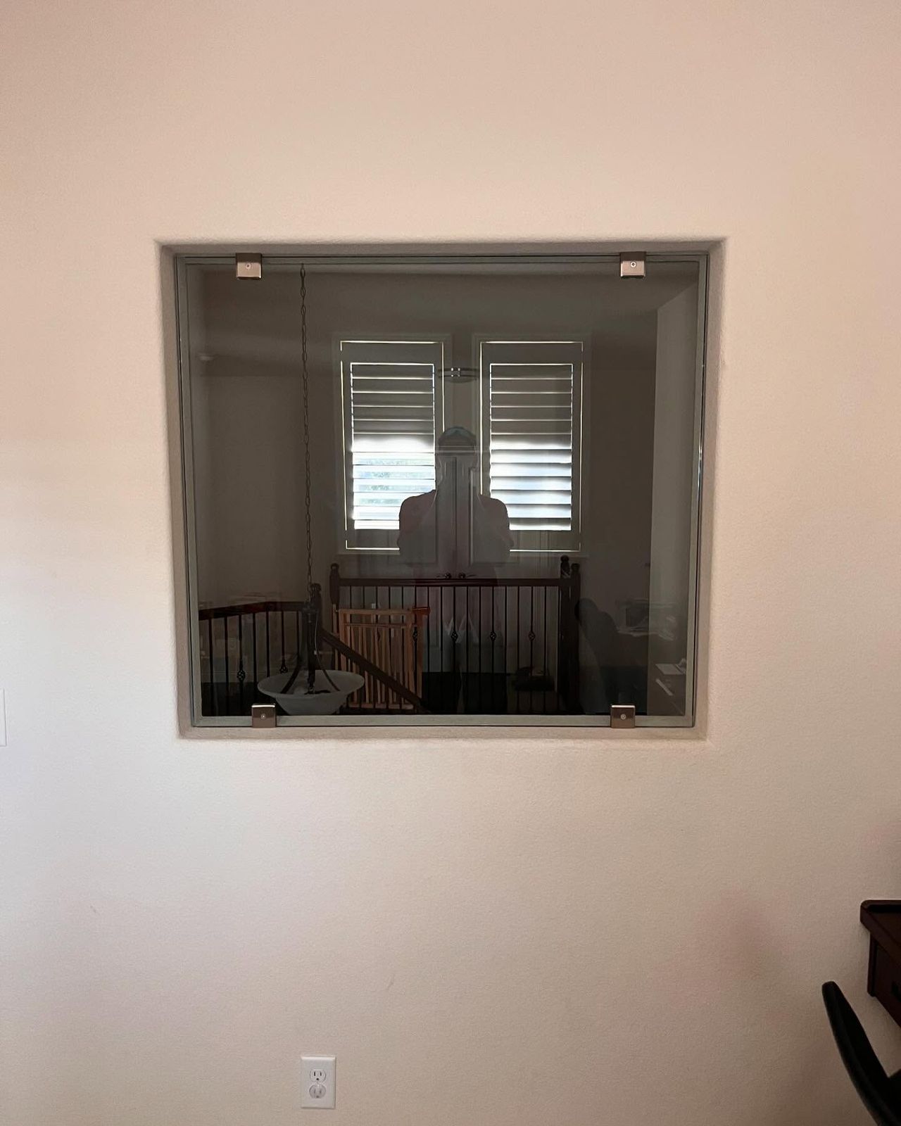 Interior glass pass-through window installed by The Door Brothers