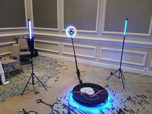 360 booth platform glowing blue in an event hall
