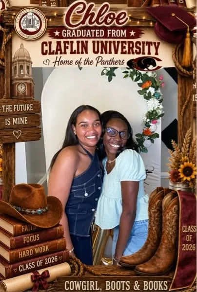 Two guests posing in a magazine cover style photo frame