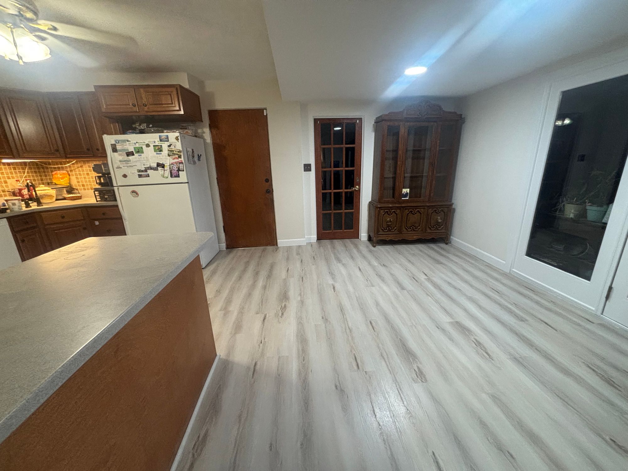 Kitchen and living room with new luxury vinyl plank flooring