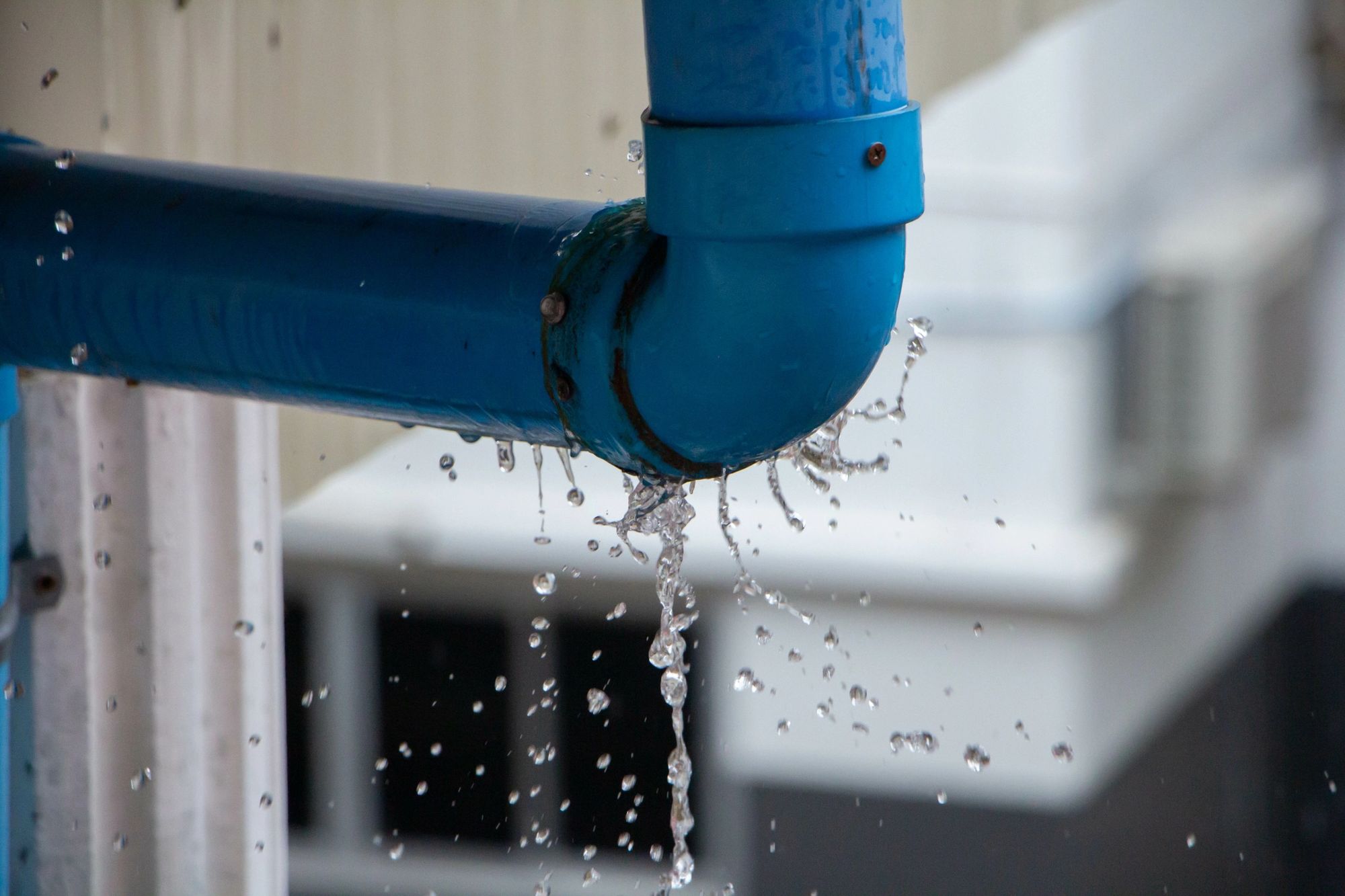 Blue water line spraying water, repaired by Maximized Plumbing & Drains