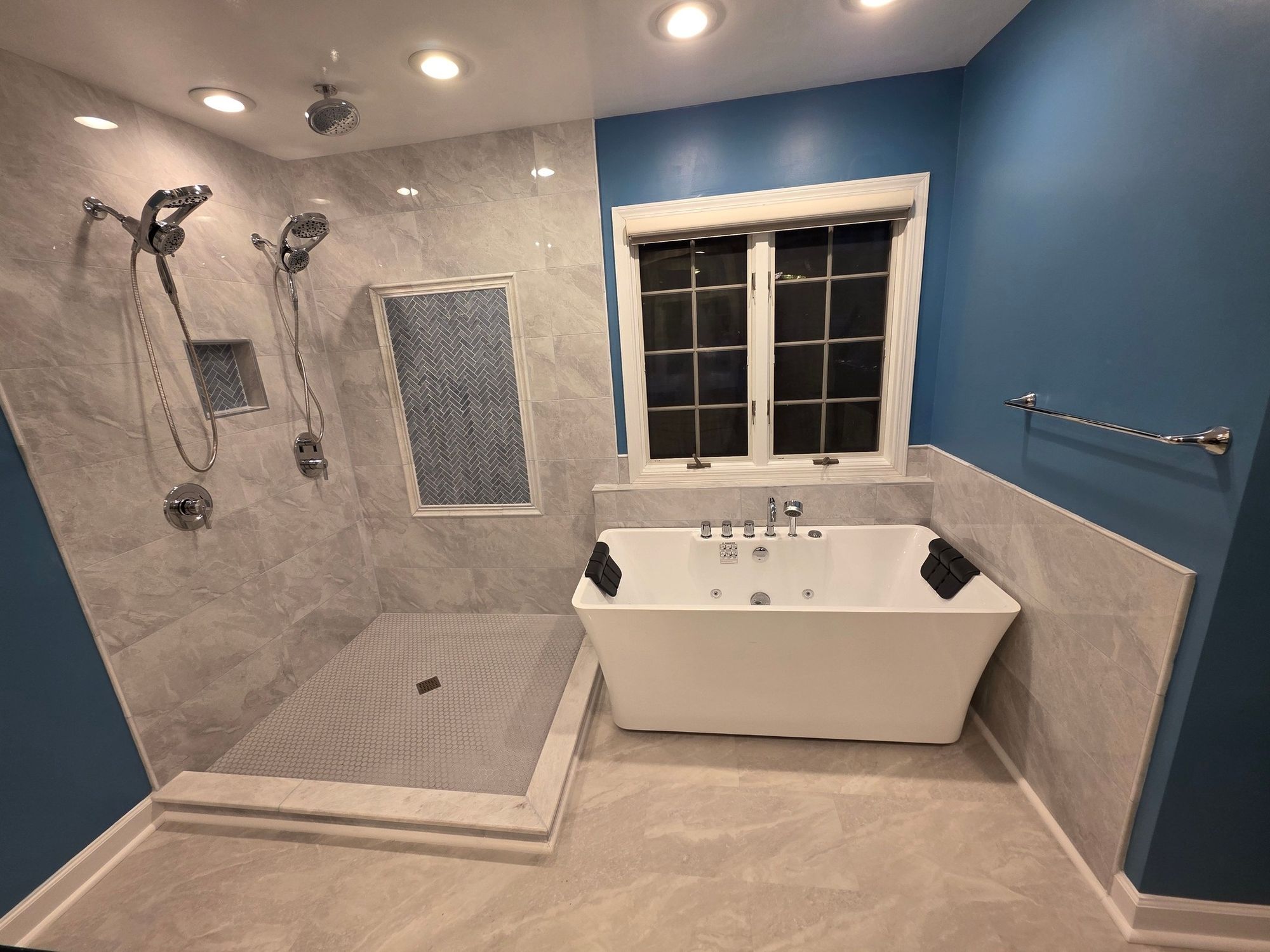 Custom master bathroom with freestanding tub and tiled walk-in shower by JB Custom Remodeling