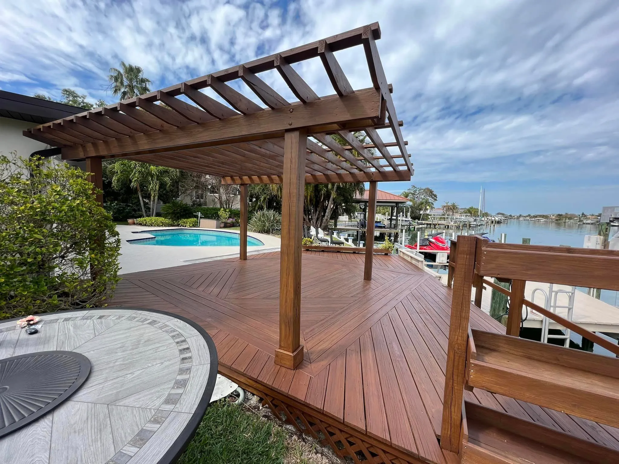 Waterfront pergola and pool deck refinished on a Tarpon Springs property