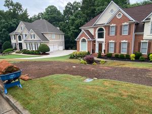 Lawn Aeration is a process that helps to improve the health and appearance of your lawn by increasing oxygen and water penetration. This service can be performed as part of our regular landscape maintenance program or as a standalone service. for Two Brothers Landscaping in Atlanta, Georgia