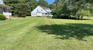 Our professional mowing service ensures your lawn stays healthy and beautifully manicured, enhancing curb appeal with precise cutting, trimming edges, and removing clippings for a pristine outdoor experience. for Lewis Oaks Landscaping in King and Queen County, VA