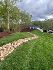 Our mowing service ensures a pristine lawn with precise cuts, regular maintenance schedules, and professional attention to detail—enhancing your property's curb appeal and promoting healthy grass growth. for JMLP Lawn & Landscaping in Charlotte, NC