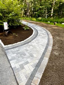 Our Walkways service offers custom design and installation of beautiful, durable pathways to enhance the aesthetic appeal and functionality of your outdoor space, providing safe passage for you and your guests. for Fernald Landscaping in Chelmsford, MA