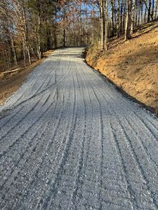 Our Driveway Construction service offers homeowners a professional and efficient solution to clear land and create a durable, functional driveway for convenient access to their property. for Holmes Septic Works LLC in Knoxville, TN 