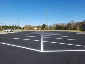 Our Asphalt sealcoating service provides a protective coating for your driveway, preventing damage from weather and wear, enhancing its appearance and extending its lifespan. for Johnson's Sealcoating & Painting in Inman, SC