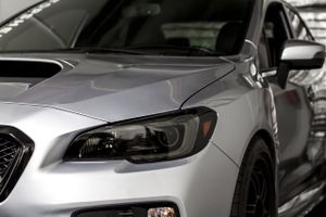 Enhance the appearance and protection of your vehicle's headlights with our Headlight Tinting service, offering a sleek look while safeguarding against UV rays and potential damage. for Certified Detailers in Atlanta, Georgia