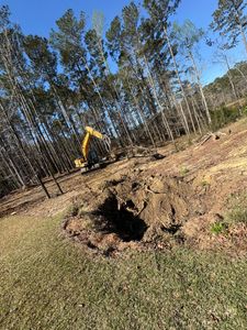 Our trenching service provides precise, efficient excavations for utilities or drainage systems, ensuring minimal disruption to your property while maintaining safety and enhancing the functionality of your outdoor spaces. for Beards Creek Construction in Grantsboro, NC