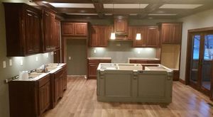 Transform your home with our expert flooring services, offering durable and stylish solutions. From hardwood to tiles, we ensure quality installation that enhances beauty and functionality in every room. for Burmeister Construction in Camdenton, MO