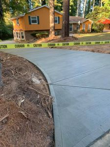 Our Sidewalk Installation service offers homeowners a professional and reliable solution to enhance the appearance of their property while providing a safe walking path for family and guests. for Compadres Concrete in Griffin, GA