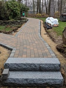 Our Walkways service enhances your home's curb appeal with professionally designed and installed walkways, ensuring durability, functionality, and aesthetic value while seamlessly integrating with your existing landscape. for J Scott Excavation and Hardscape in Littleton, MA