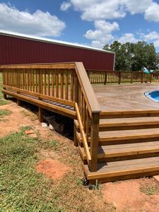 Our Porch Installation service offers homeowners a seamless experience in constructing and enhancing their outdoor living spaces, transforming them into functional and aesthetically pleasing areas to relax and entertain. for A’Hearn Construction  in Prague, OK