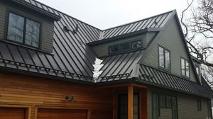 Our Metal Standing Seam Roofing service offers durable and long-lasting roofing options that provide excellent protection against harsh weather conditions for your home. for NPR Roofers in Nashville, TN